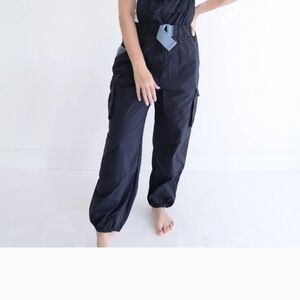 Free People Black Jumpsuit with Relaxed Fit and Tapered Legs